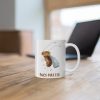 white ceramic coffee mug with a watercolor painting of a startled fruit fly the mug is on a table