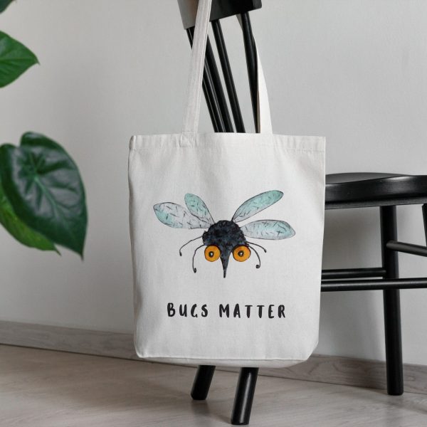 white canvas tote bag with a watercolor painting of a whimsical mosquito