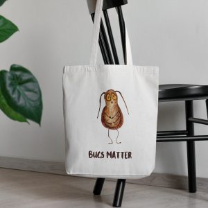 white canvas tote bag with a watercolor painting of a whimsical cockroach